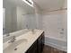 Bathroom featuring double sinks and a shower/tub combo at 1942 Eastway Dr, Dallas, NC 28034