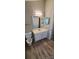 Clean bathroom with single sink vanity, and updated flooring at 5720 Ebley Ln, Charlotte, NC 28227