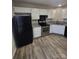 Updated kitchen with stainless steel appliances and white cabinets at 5720 Ebley Ln, Charlotte, NC 28227