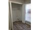 Laundry closet with shelving and hook for hanging clothes at 5720 Ebley Ln, Charlotte, NC 28227