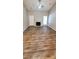 Spacious living room featuring a fireplace and wood-look flooring at 5720 Ebley Ln, Charlotte, NC 28227