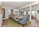 Bright dining room with wood table and seating for six, open to living area at 3008 Endhaven Terraces Ln # 13, Charlotte, NC 28277