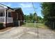 Brick house with carport and chain link fence at 500 Doffin Ln, Gastonia, NC 28052