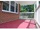 Spacious covered porch with red floor at 500 Doffin Ln, Gastonia, NC 28052