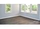 Bright living room with wood-look floors and large windows at 500 Doffin Ln, Gastonia, NC 28052