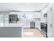 Modern white kitchen with stainless steel appliances and island at 335 Davidson Hwy, Concord, NC 28027