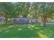 Ranch style home with gray exterior and landscaped lawn at 335 Davidson Hwy, Concord, NC 28027