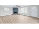 Living room with fireplace and wood-look floors at 335 Davidson Hwy, Concord, NC 28027