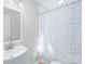 Clean bathroom with white vanity and shower/tub combo at 335 Davidson Hwy, Concord, NC 28027
