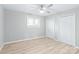 Bright bedroom with hardwood floors, ceiling fan and double closets at 335 Davidson Hwy, Concord, NC 28027
