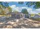 Side view of a renovated gray house with a patio and landscaping at 335 Davidson Hwy, Concord, NC 28027