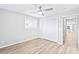 Well-lit bedroom with hardwood floors and access to the kitchen at 335 Davidson Hwy, Concord, NC 28027