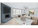 Living room with fireplace, large windows, and neutral decor at 335 Davidson Hwy, Concord, NC 28027