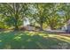 Large backyard with mature trees and a shed at 335 Davidson Hwy, Concord, NC 28027