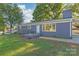 Ranch style home with gray exterior and brick walkway at 335 Davidson Hwy, Concord, NC 28027