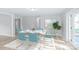 Dining area with modern table and chairs near back door at 335 Davidson Hwy, Concord, NC 28027