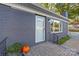 Brick ranch home with a covered entryway and well-maintained landscaping at 335 Davidson Hwy, Concord, NC 28027