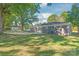 Rear view of a renovated gray house with a large backyard at 335 Davidson Hwy, Concord, NC 28027