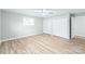 Large bedroom with hardwood floors, double closets and ceiling fan at 335 Davidson Hwy, Concord, NC 28027