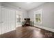 Cozy bedroom with hardwood floors and a workspace at 225 Flint St, Charlotte, NC 28216