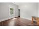 Spacious bedroom with hardwood floors and a window at 225 Flint St, Charlotte, NC 28216