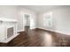 Bright living room featuring hardwood floors and a fireplace at 225 Flint St, Charlotte, NC 28216