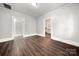 Bright living room with hardwood floors and access to other rooms at 225 Flint St, Charlotte, NC 28216