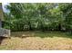 Spacious backyard surrounded by lush greenery at 225 Flint St, Charlotte, NC 28216