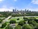 Aerial view showing home and city skyline in the distance at 225 Flint St, Charlotte, NC 28216