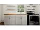 Modern kitchen with stainless steel appliances and wood countertops at 225 Flint St, Charlotte, NC 28216