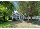 Gray house with green door and front yard at 225 Flint St, Charlotte, NC 28216
