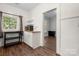 Kitchen view with microwave, cabinets and a view into another room at 225 Flint St, Charlotte, NC 28216