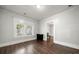 Living room with hardwood floors and access to other rooms at 225 Flint St, Charlotte, NC 28216