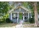 Gray house with green door and porch at 225 Flint St, Charlotte, NC 28216