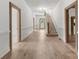 Long hallway with light wood floors and high ceilings at 2400 Redbud Dr, Gastonia, NC 28056