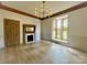 Bright dining room featuring a large window and fireplace at 2400 Redbud Dr, Gastonia, NC 28056