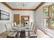 Formal dining room with glass table and seating for six at 2400 Redbud Dr, Gastonia, NC 28056