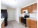 Kitchen boasts wood cabinets, granite counters and stainless steel appliances at 1632 Sandpiper Dr, Rock Hill, SC 29732