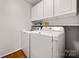Bright laundry room with washer, dryer, and ample cabinet storage at 1447 London Dr, Rock Hill, SC 29732
