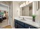 Bathroom with navy vanity, lighted mirror, and tile floors at 1447 London Dr, Rock Hill, SC 29732