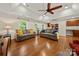Bright living room with hardwood floors and view into kitchen area at 1447 London Dr, Rock Hill, SC 29732