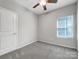 Cozy bedroom with neutral walls, carpet flooring, and a ceiling fan at 24601 Blue Heron Cir, Lancaster, SC 29720