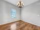 Bright dining room with hardwood floors and a chandelier at 24601 Blue Heron Cir, Lancaster, SC 29720