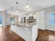 Kitchen with white cabinets, granite countertops, and island at 24601 Blue Heron Cir, Lancaster, SC 29720