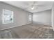 Primary bedroom with ceiling fan and neutral decor at 24601 Blue Heron Cir, Lancaster, SC 29720