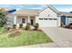Attractive exterior of a ranch home with a two-car garage and well-manicured lawn at 24601 Blue Heron Cir, Lancaster, SC 29720