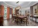 Spacious dining room with hardwood floors, large windows, and elegant decor at 3016 Applewood Point Ln, Belmont, NC 28012