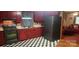 Kitchen with red cabinets and checkered floor at 102 Aderholdt Rd, Bessemer City, NC 28016