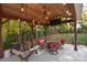 Relaxing pergola with seating area and tv at 860 Arrow Point Ln, Davidson, NC 28036