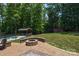 Spacious backyard with pool, fire pit, and pergola at 860 Arrow Point Ln, Davidson, NC 28036